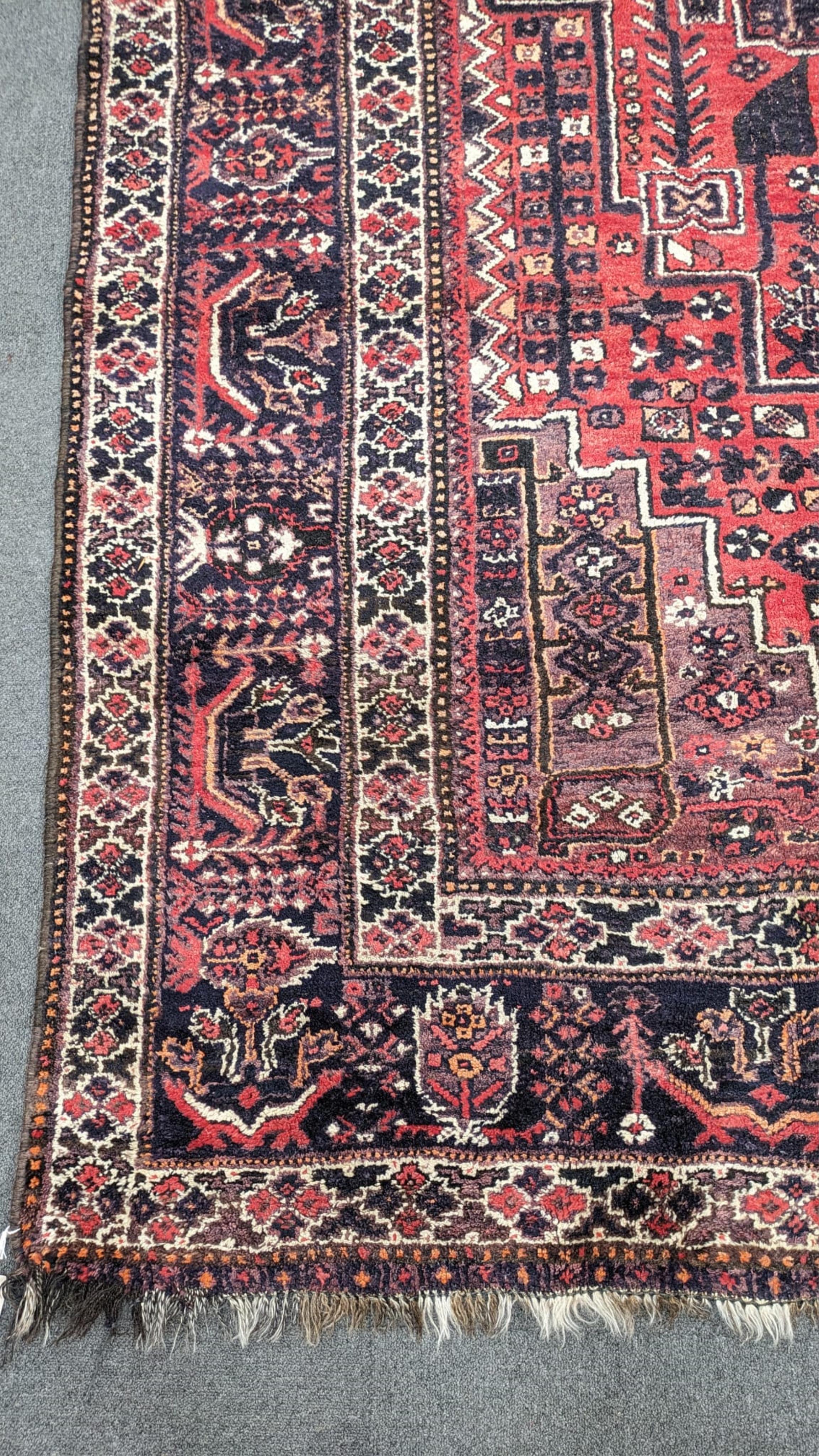 A Persian Shiraz carpet, 300 x 210cm
